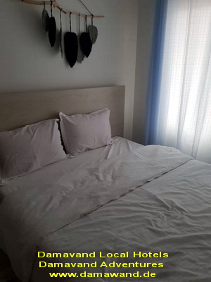 Inside a rustic local hotel, hostel, guesthouse, and house near Mount Damavand